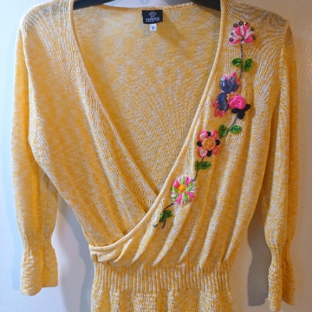 Versace sweater top. Deep V cut ,size small. Light yellow and white.